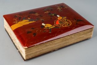 An antique Chinoiserie lacquered album with photographs of Japanese early colonial interest