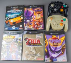 Two Nintendo Game Cube consoles together with five assorted boxed games to include: The Legend of