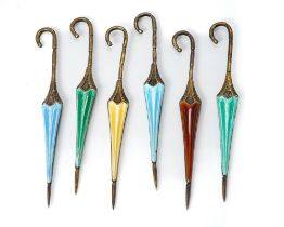 A set of six silver and enamel cocktail sticks modelled as umbrellas, in green, blue, red and yellow