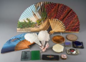 A collection of compacts including Stratton; fans including Ostrich feathers circa 1915; hand