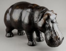 A leather Hippopotamus in the manner of Liberty footstool, with glass eyes. approx. 45cm long x 26cm