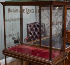 A late Victorian/ early 20th Century mahogany framed shop display cabinet for "Macfarlane Lang &