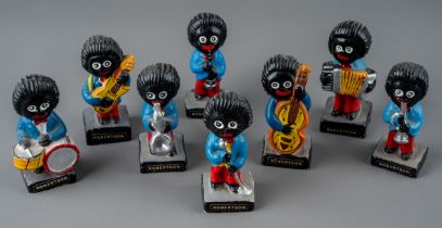 A set of eight vintage Robertsons Jam advertising Jazz band ceramic figures (8) wear commensurate