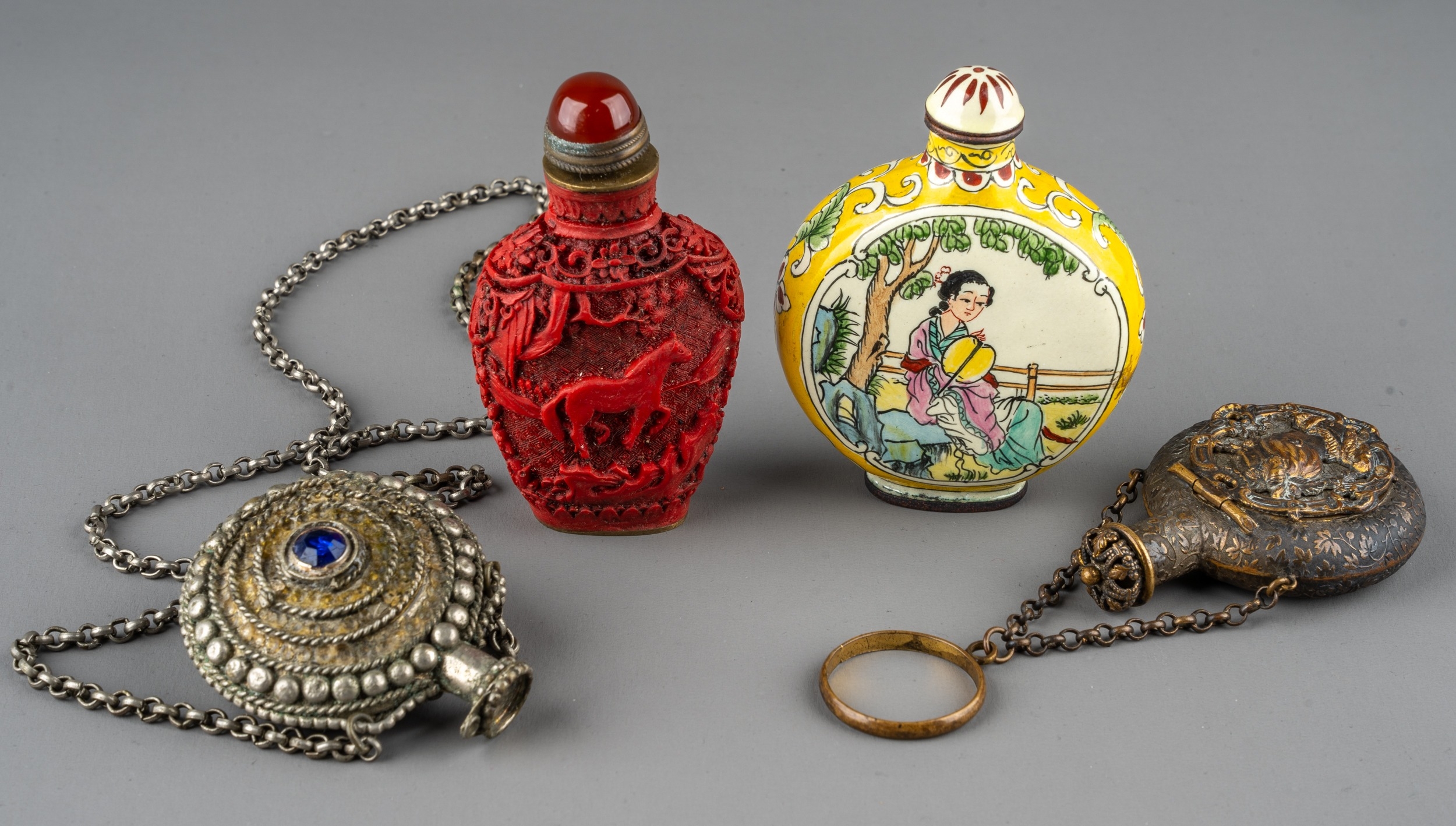 A collection of Chinese snuff bottles, including an ovoid cinnabar bottle depicting horses amongst - Image 2 of 4