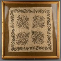 An early embroidery needlework square in bullion thread. Made in four sections, later framing. The