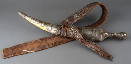 A 19th century Wahabi Jambiya dagger which is mounted in silver and brass with leather belt, tt