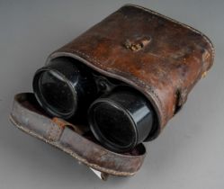 A pair of vintage binoculars, with fitted leather case Damage to case - see photos