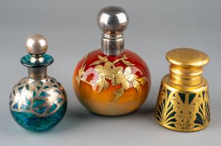 A globular coloured glass scent bottle, in tones of burnt orange and yellow, applied with foliate