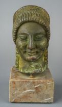 An early bronze head of Athena, of classical Roman design, on later marble plinth, approx 12.5cm