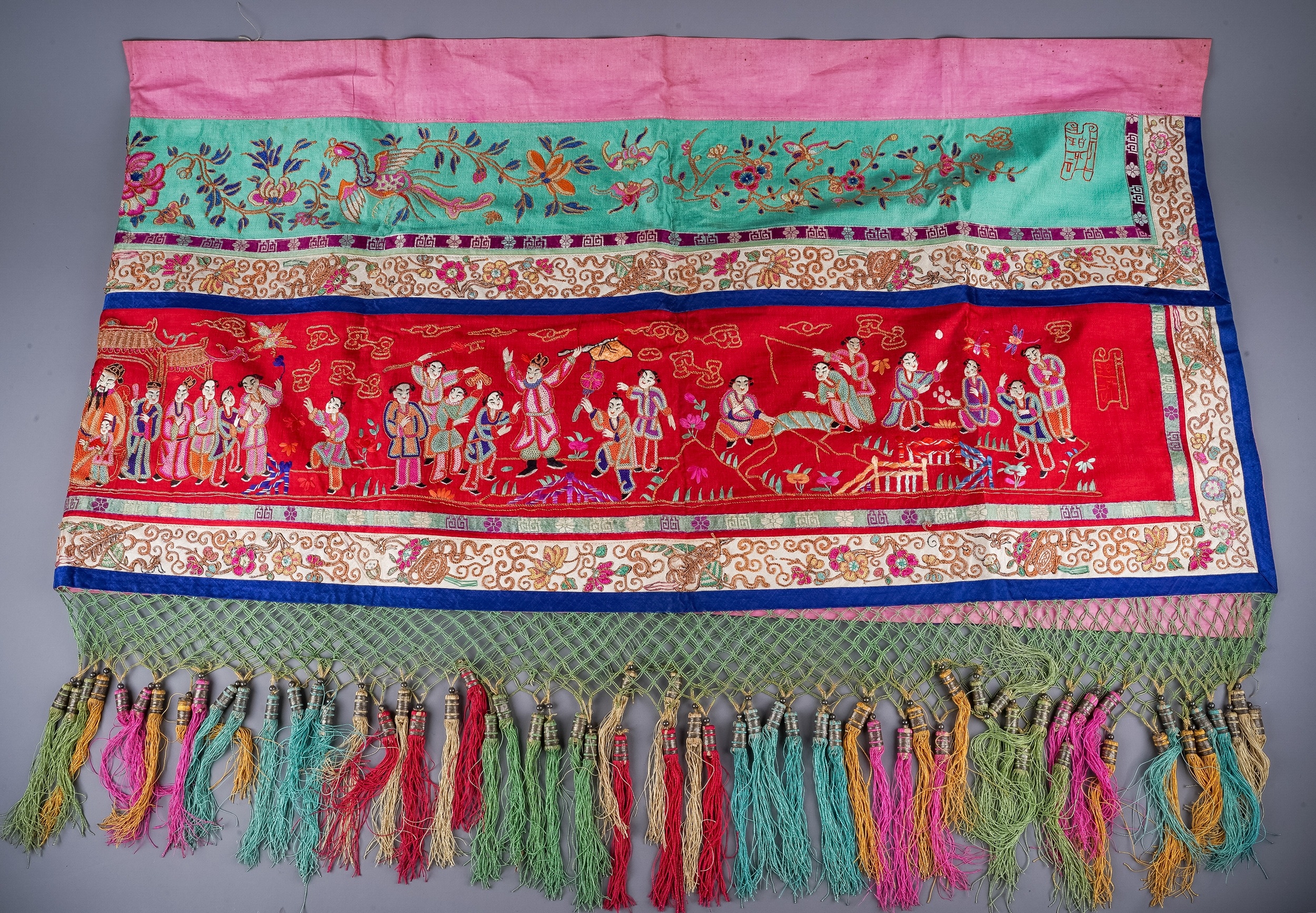 A Chinese embroidered silk wall hanging, the central section with central seated Deity and child - Image 2 of 4