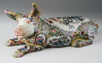 A Japanese porcelain pig, the body decorated with vignettes depicting vase of flowers and birds, the