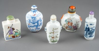 A collection of Chinese snuff bottles, including an enameled bottle decorated with dragons and