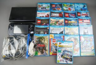 Nintendo Wii U game pad, console, power cables and collection of twenty one assorted boxed / cased