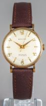 A gentleman's 9ct yellow gold cased Baume wristwatch, the 28mm circular dial with gold Arabic and