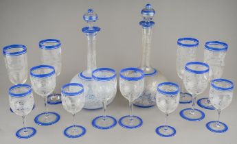 An early 20th Century Continental glass suite, to include two decanters with stoppers with four