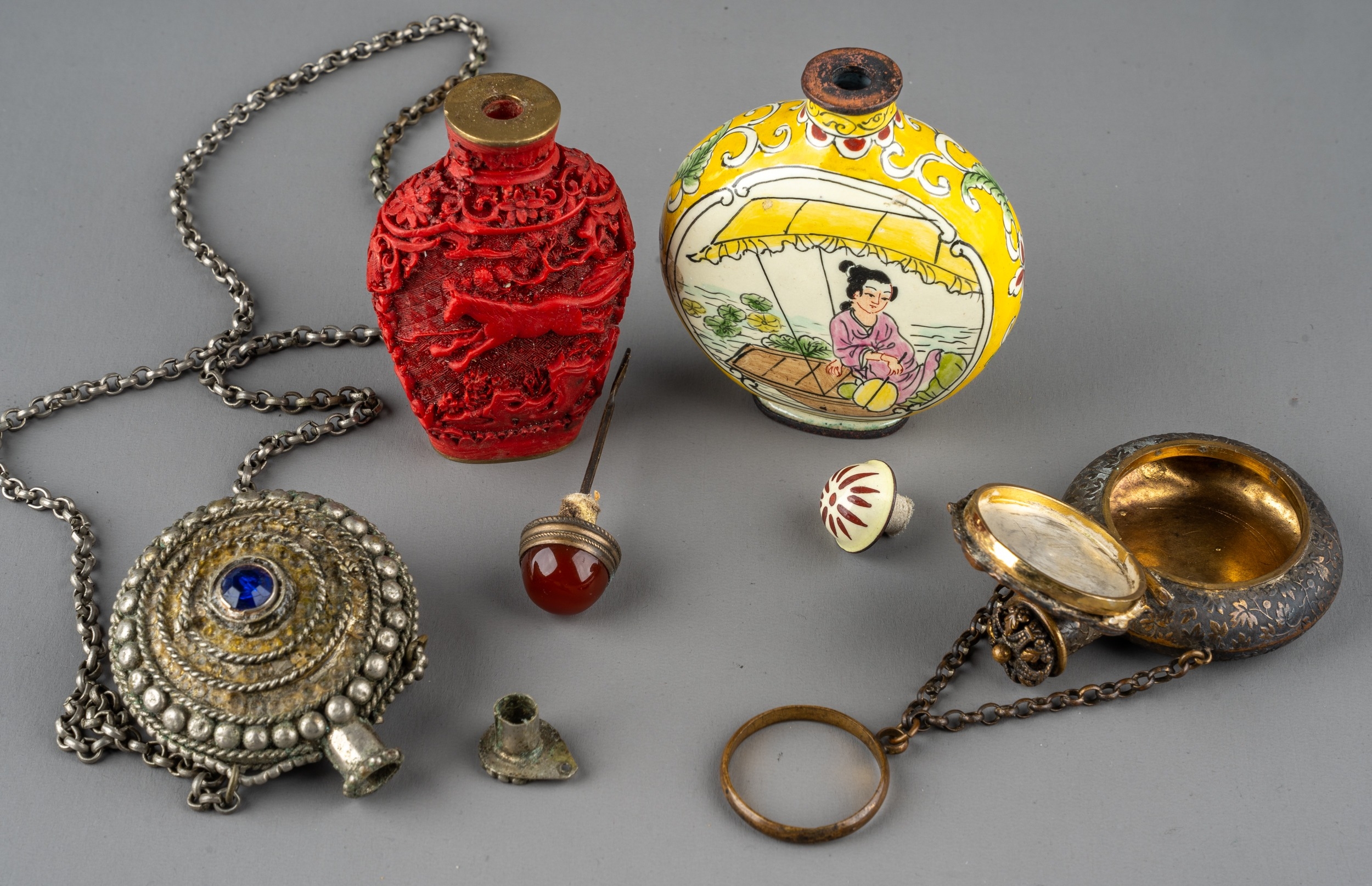 A collection of Chinese snuff bottles, including an ovoid cinnabar bottle depicting horses amongst - Image 3 of 4
