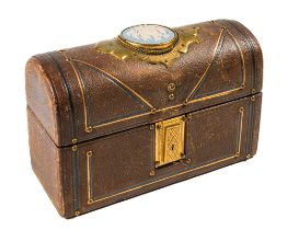 A Victorian leather domed casket, applied with brass fittings, the top inlaid with a Jasper ware