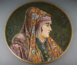 A pair of late 19th Century large circular portrait plaques, each moulded and decorated with Persian