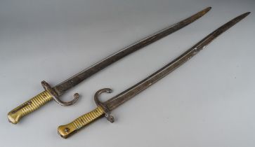 Two 19th Century French pattern Chassepot sword bayonets with steel scabbards, brass grips,