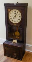 The Gledhill Brook Time Recorders Ltd: an early 20th century oak cased clocking-in clock, number