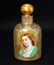 A 19th century continental glass scent bottle, having a raised oval plaque enameled with a