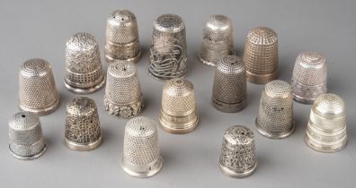 A collection of 16 silver thimbles, various sizes and dates
