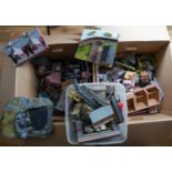 Two boxes of assorted model railway kit buildings to include: houses, factories, stations,