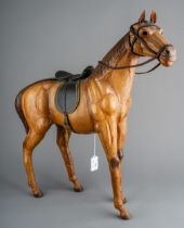 A Modern leather model of a horse complete with tack, approx 51cm at highest point