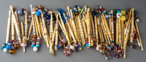 Collection of approximately 58 named Victorian carved bone lace bobbins, many with glass spangles.