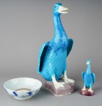 A Chinese earthenware blue and white dish, wo ducks and bowl, 12cm diam (hairline crack) together