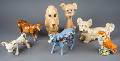 A collection of ceramic animals to include: John Beswick Jersey cow; Beswick Owl, Modern Lowry Cow