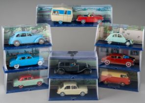 A collection of Tintin Herge Moulinsart die cast models, all in perspex case with background
