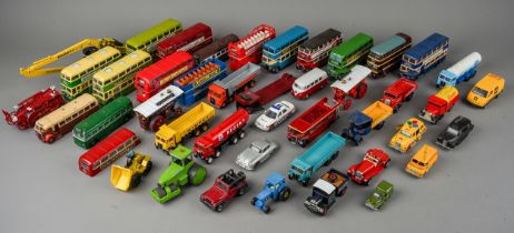 A large assorted collection of vintage die cast models of dinky cars, buses, trucks, tractors