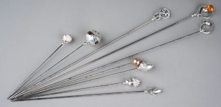 A collection of five various early 20th Century silver mounted Charles Horner hat pins, all