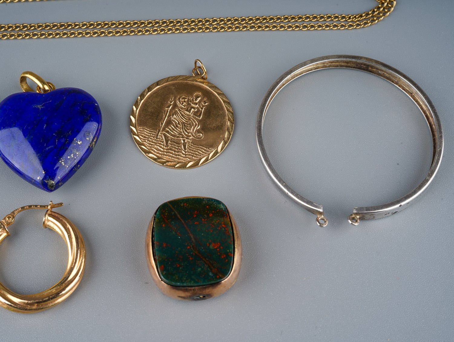 A lapis lazuli hear pendant, on a yellow gold bale stamped '750', gross weight approx 9g; a 9ct gold - Image 2 of 3