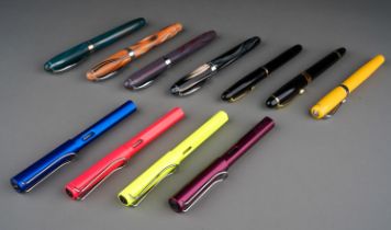 A collection of pens to include: Jinhao black and gilt fountain pen, the nib stamped 18K GP with