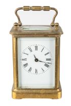 A French brass eight-day carriage clock, with key In working order, small chip on inside of the side