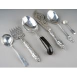 A collection of silver flatware to include: 1. an American early 20th Century large serving spoon,