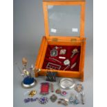 A collection of silver, including medals, enamelled badges, propelling pencil, cheroot holder,