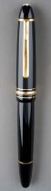 A Montblanc Meisterstuck black fountain pen, gilt fittings, the 14K white and yellow gold nib