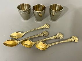 A set of four Russian 916 standard silver gilt ornate coffee spoons, the bowls stamped, gross weight