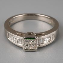 A platinum and diamond ring, set with four princess-cut diamonds in a square setting, baguette-cut