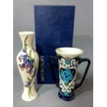 Moorcroft twin handled vase, signed R.B. Bishop in a box together with Bluebell Harmony vase