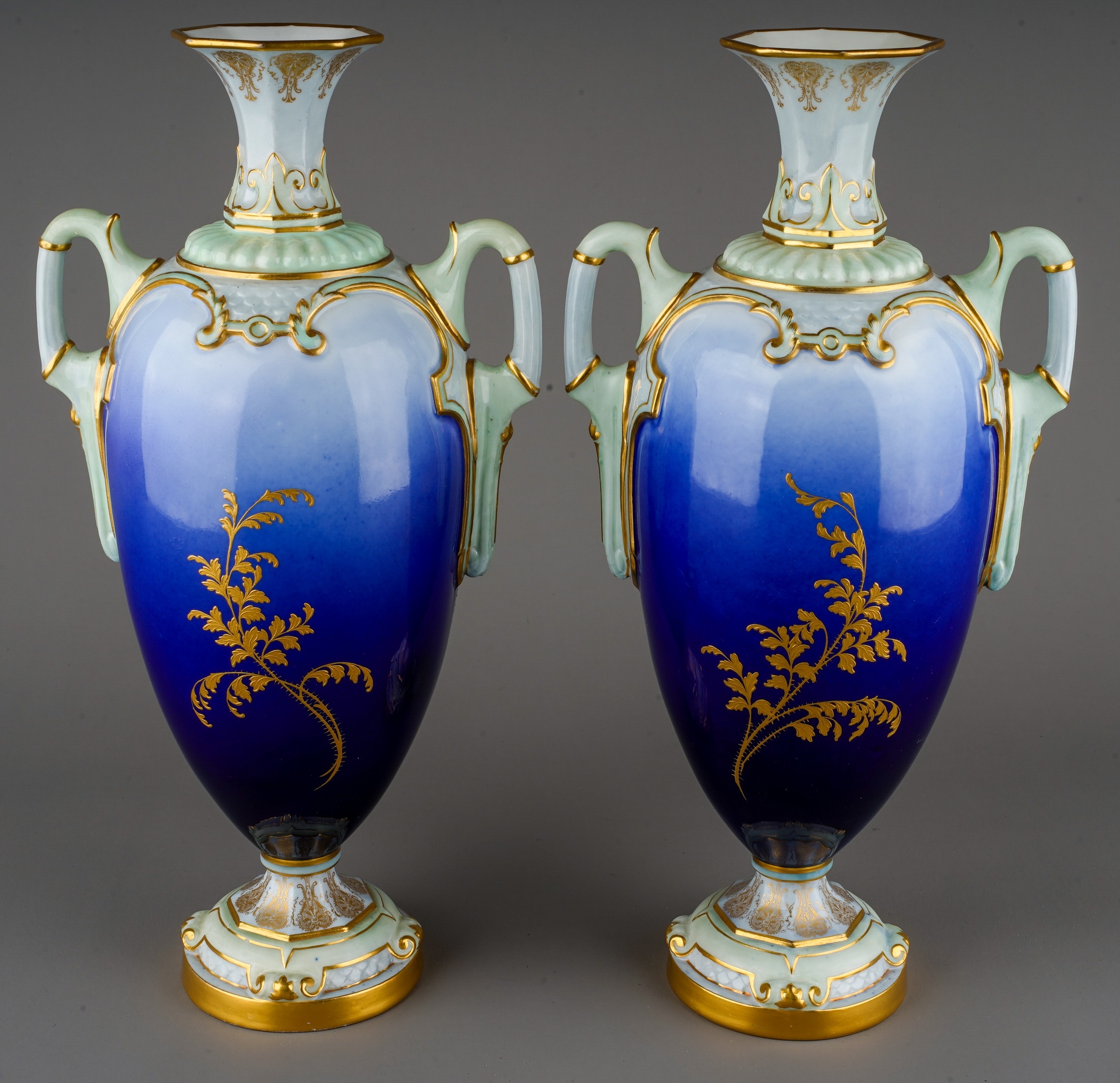 A pair of early 20th Century Royal Worcester vases, shape no: 2256, with flared octagonal necks, the - Image 2 of 4