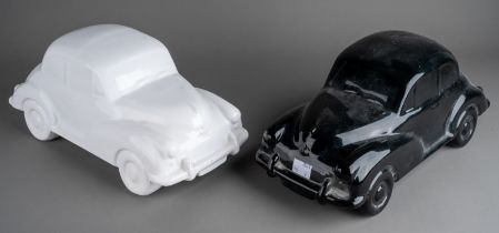 Two large Dartmouth style ceramic car models to include a black and a white Morris Minor 1000 (2)