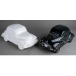 Two large Dartmouth style ceramic car models to include a black and a white Morris Minor 1000 (2)