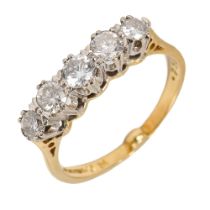 An 18ct yellow gold and diamond five stone ring, set with round brilliant cut diamonds, ring size