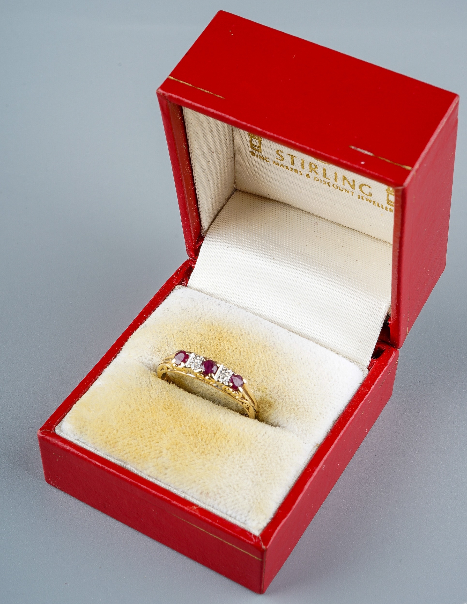 A 9ct yellow gold ruby and diamond ring, set with three round-cut rubies with diamond-chip - Image 6 of 6