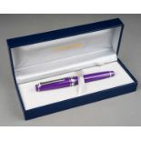 A group of three Japanese Sailor fountain pens in yellow, purple or red, all with 14k white or