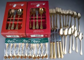 Two boxed gold plated Santa Cruz 20 piece cutlery sets together with another 20 piece loose set